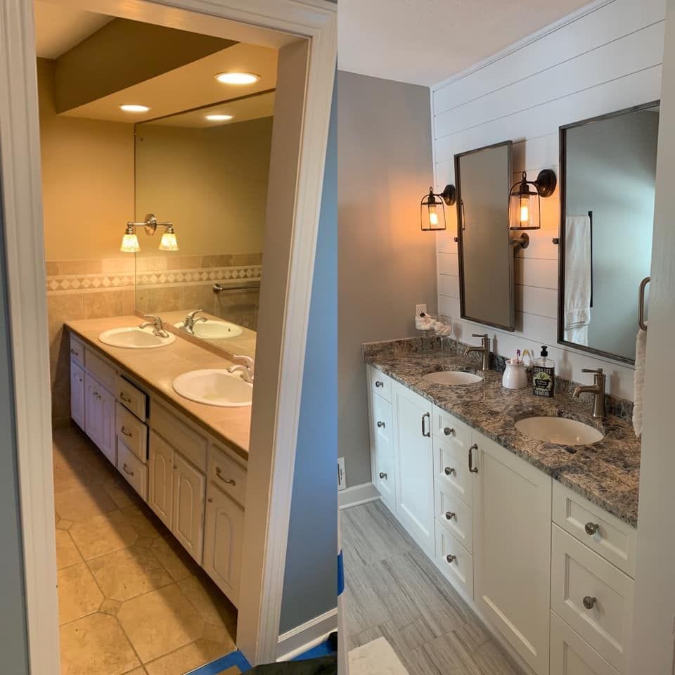 Before and after of a double vanity: beige laminate vanity with oak doors on the left; white shaker double vanity with granite top, undermount sinks, black-framed mirrors, cage sconces, and a shiplap wall on the right